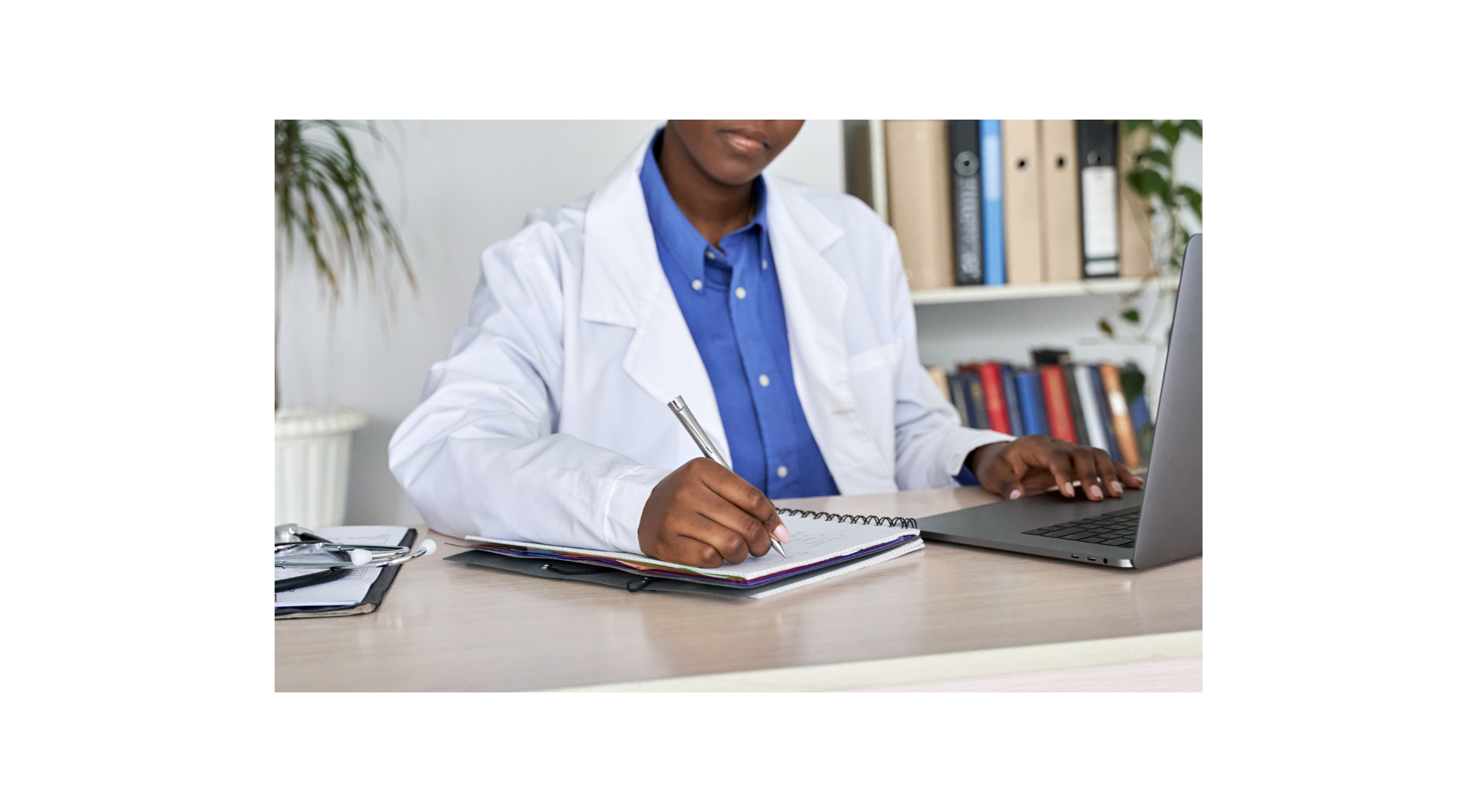 Clinician performing administrative work at a desk