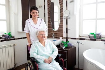 nurse_helping_woman_in_wheelchair.jpg