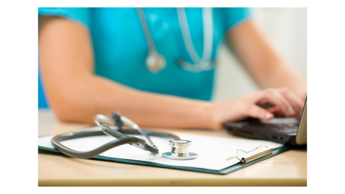 Medical professional with stethoscope typing notes