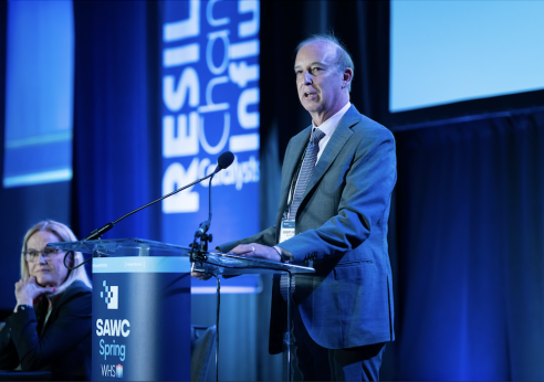 Speaker on stage at SAWC Spring conference