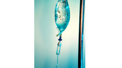 IV bag hanging on blue green background