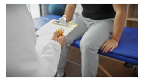 Doctor with a patient and a medication list