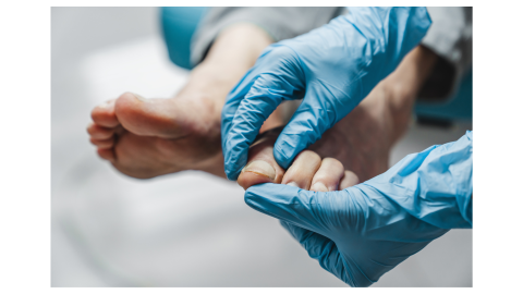Medical professional examining a patient's toes