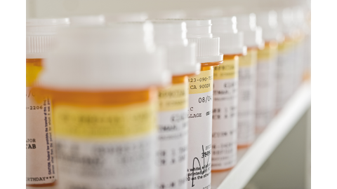 prescription pill bottles lined up