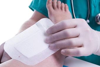 Nurse Removing Adhesive Bandage to Prevent MARSI